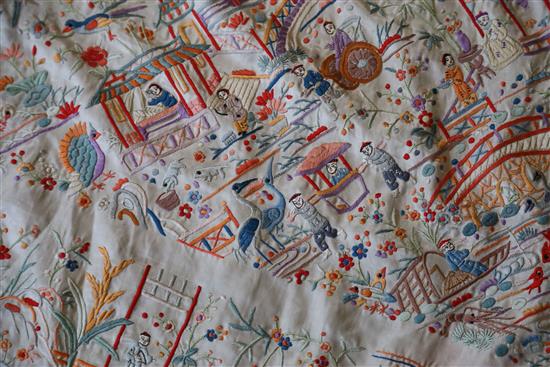 A Chinese embroidered silk table cover, late Qing dynasty, 153cm square excluding fringe